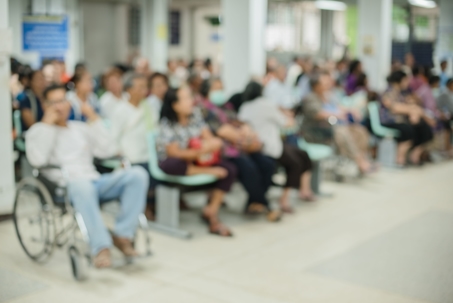 blurred image of a crowded hospital waiting room